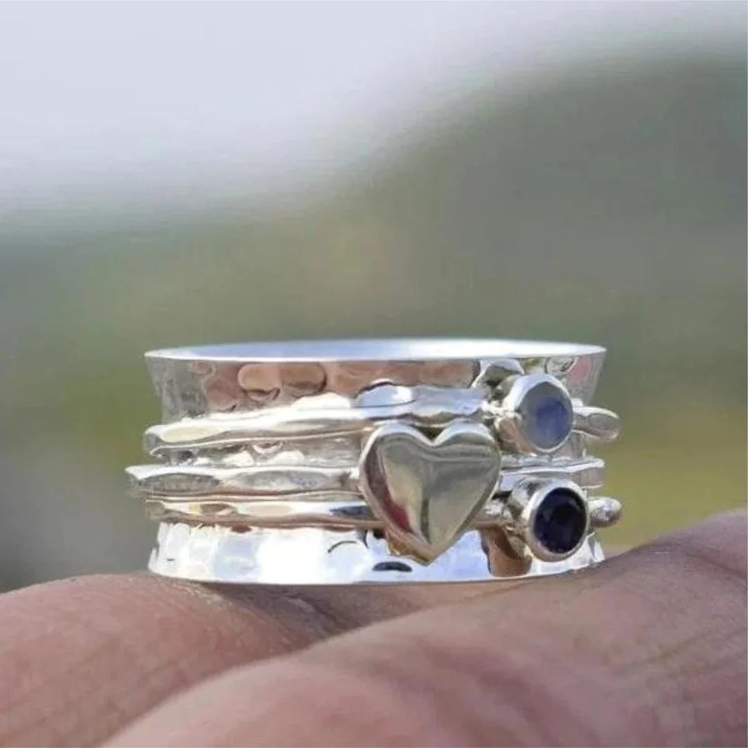 Élégante bague à cœur rotatif en argent sterling – Paradise Designs