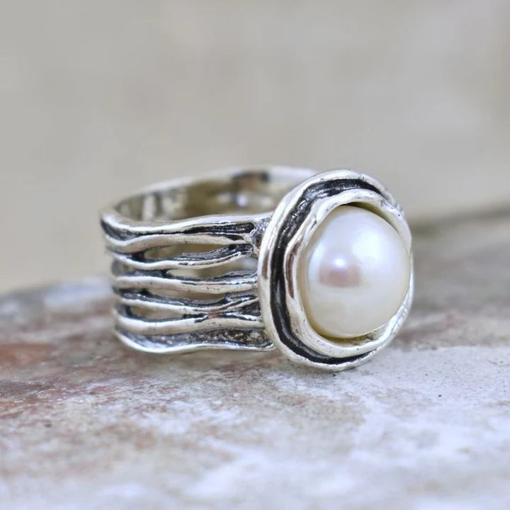 Bague en argent avec superposition de pierres blanches