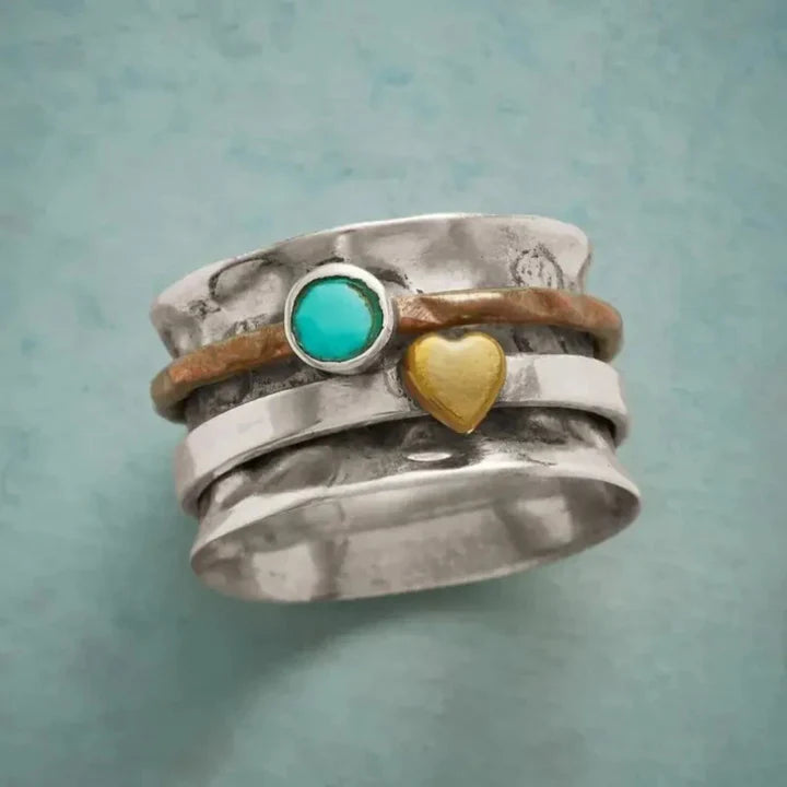 Bague argentée avec cœur en or et pierre turquoise