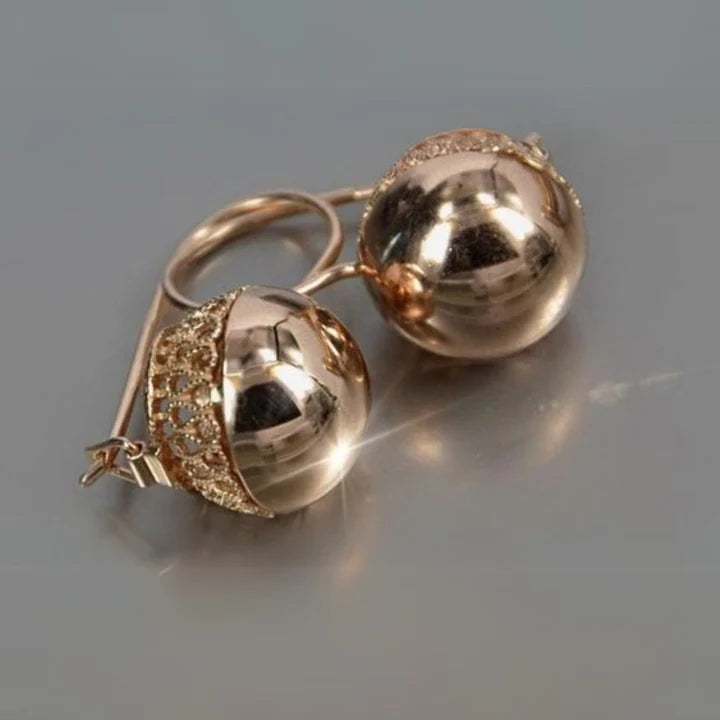 Boucles d'oreilles en verre doré arrondi