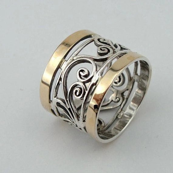 Bague creuse en or et argent avec motif de lierre
