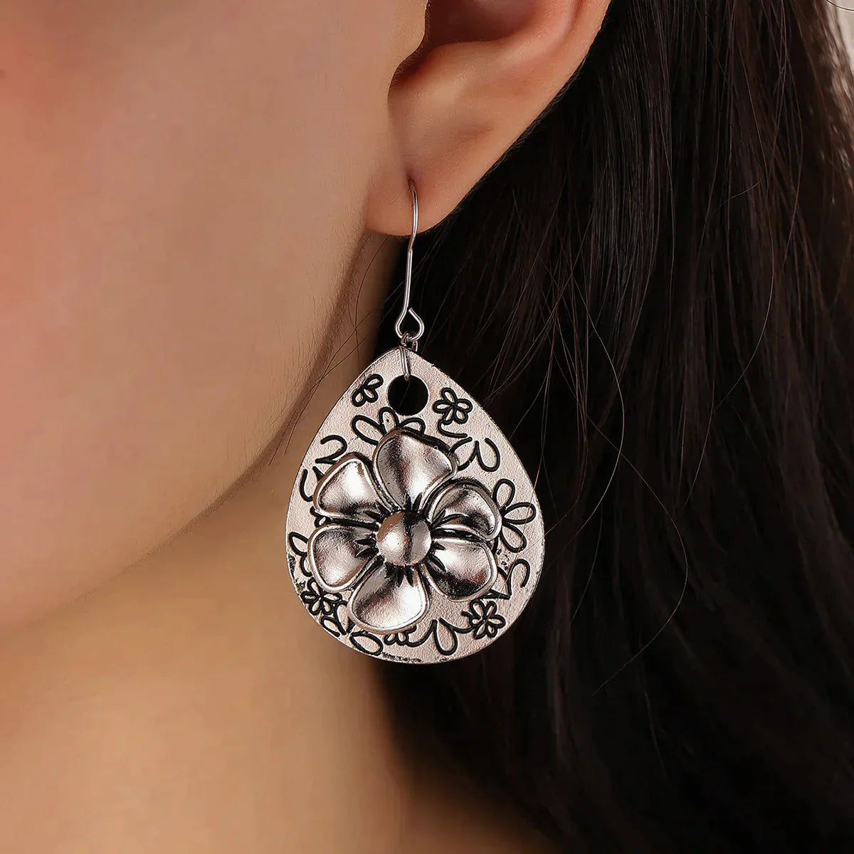 Boucles d'oreilles argentées florales boho