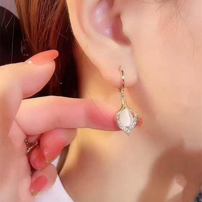 Boucles d'Oreilles Pendantes en or avec Ppale Blanche et Zirconia