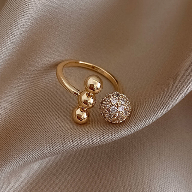 Bague triple sphère dorée brillante