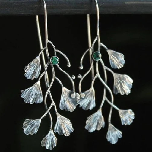 Boucles d'oreilles feuilles en argent avec zirconias