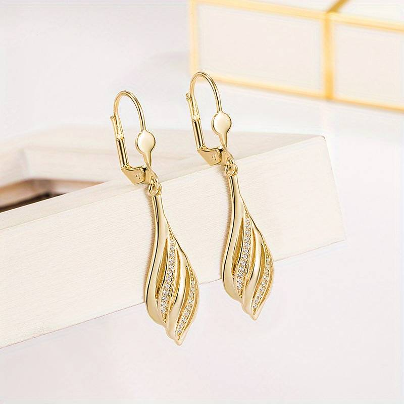 Boucles d'oreilles vintage dorées et brillantes